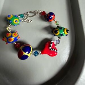 Glass beaded bracelet with silver clasp.